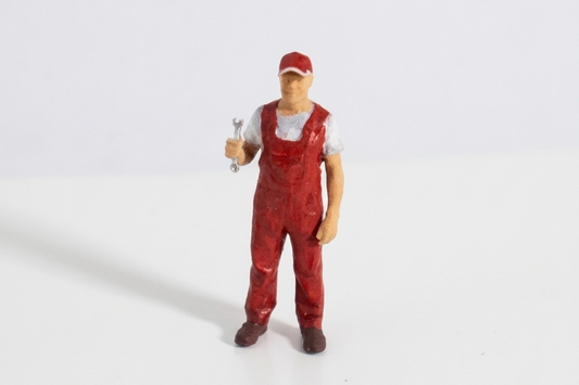 Figura mecánico miniatura 1:64 overol rojo con llave