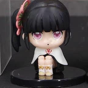 Figuras de Kimetsu No Yaiba sentados con base